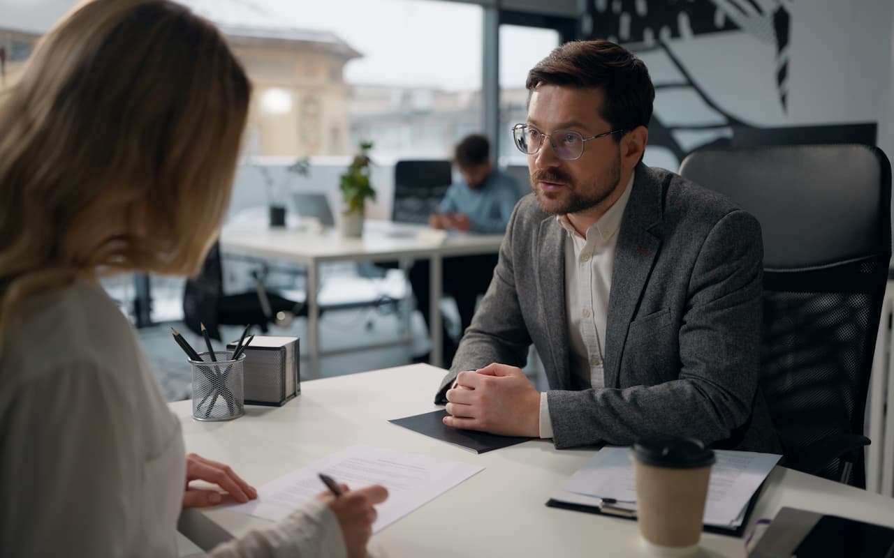 A sales representative negotiating with his manager for higher pay
